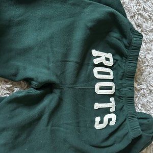 Roots, green sweatpants